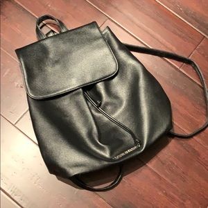 Black drawstring faux leather backpack
